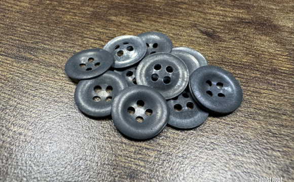 Genuine old production lot of zinc army shirt buttons.