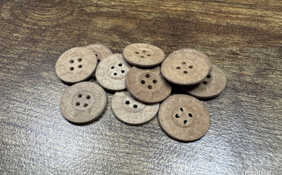 Genuine old 1940-1950 era production lot of paper pressed buttons.