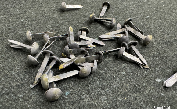 Set of 30 metal rivets from old stock.