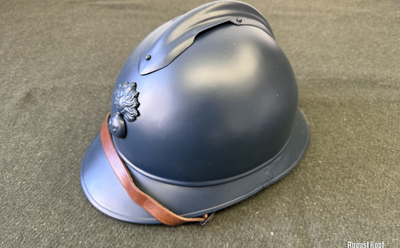 Very well made reproduction of French steel helmet in blue color with authentic leather chinstrap and liner.