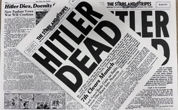 A reproduction piece of newspaper from the end of war.
