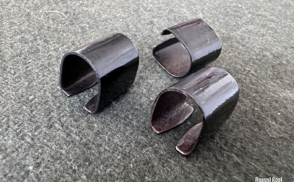 Metal reproduction of rifle sight part.