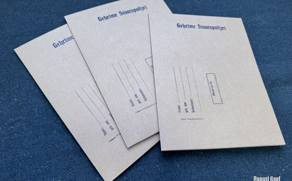 Paper folder for A4 documents inspired by the bureaucratic style of mid-20th century secret police administration.