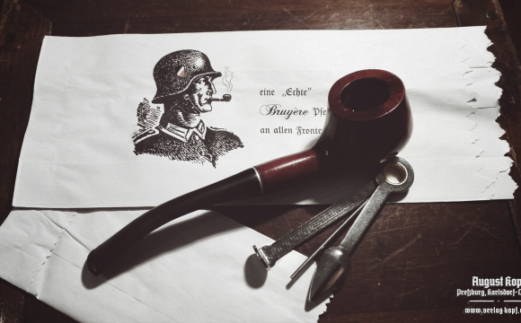 A new pipe made of nice pie-cherry wood, chosen to represent a commonly available pipe used during WW2.