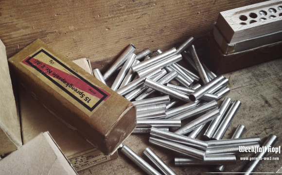 A complete Sprengkapsel n8 wooden box filled with repro detonators, in protective cardboard package, sealed, completed with marked labels.