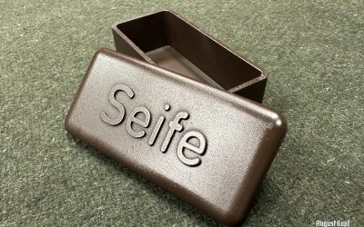 Well known bakelite box for storing small portion of soap inside sanitators leather pouches.