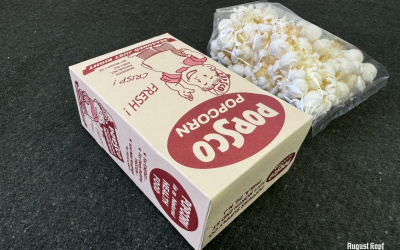 Salted popcorn sealed in a cellophane bag and packed in a reproduction 1930’s-1940’s box.