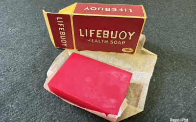 Handmade red colored soap wrapped in parchment paper and packed in a vintage 1940’s reproduction box.