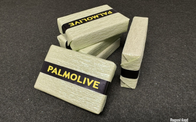 Green rectangle shaped soap wrapped in crepe paper and packed in a vintage 1940’s design.