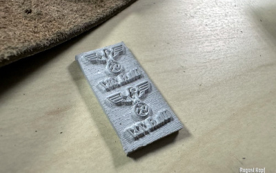 Small but important addition to many replicas are Army acceptance markings.
