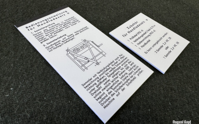Pair of instructional sheets printed on 1,5mm thick paper desks.