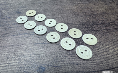 Genuine old 1940-1950 era production lot of paper pressed buttons.