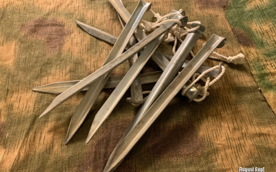 Long post war tent pegs in used condition.