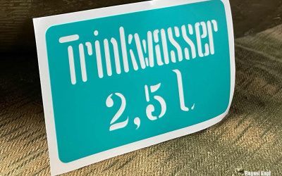 Plastic sticker stencil for popular Trinkwasser canisters.