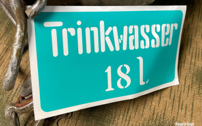 Plastic sticker stencil for popular Trinkwasser canisters.