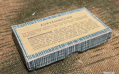 Pretty unique reproduction of cardboard box for map curve measuring tool.