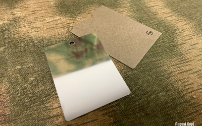 Durable steel mirror in cardboard pouch, inspired by original item.