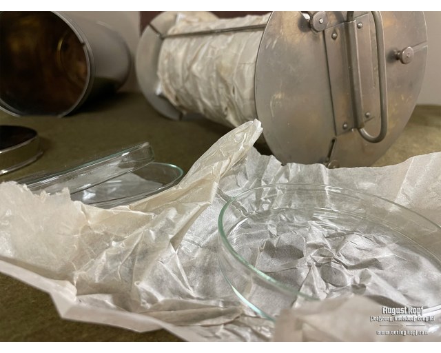 Vintage Petri dishes transport container with content